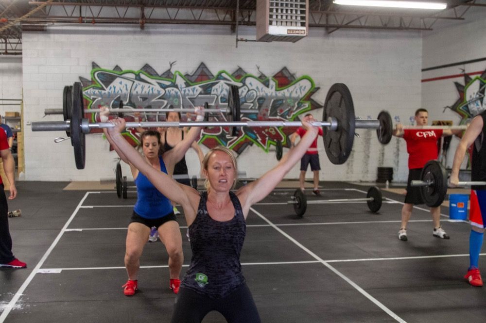 Photo of people lifting weights