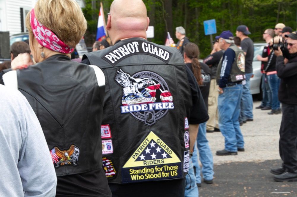 Photo of biker with patches on vest