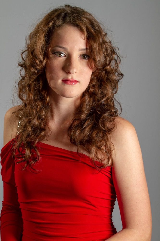 Portrait photograph of woman in red dress