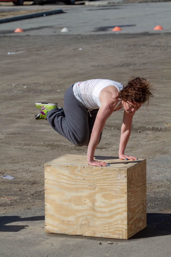 Photo of woman jumping on box